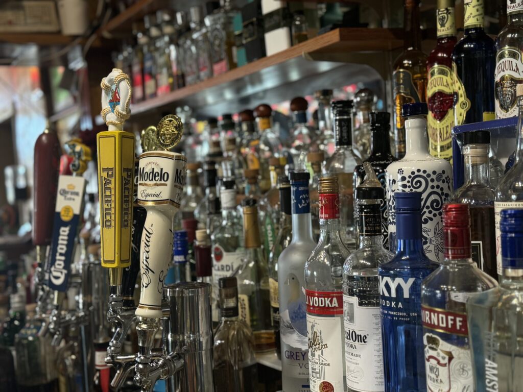 Various beverage bottles displayed at La Tapatia's beverage counter