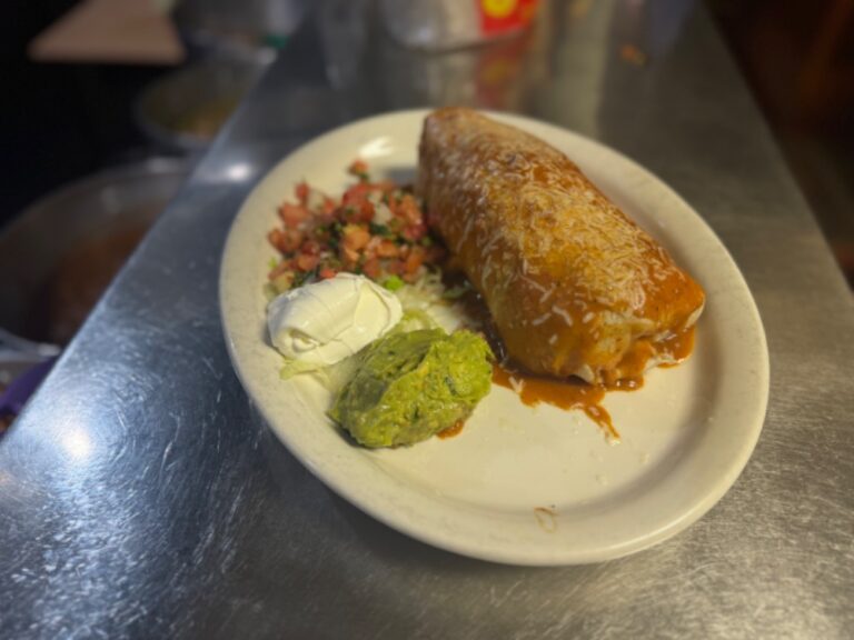 Ground beef super burrito served with tomato salad, sour cream and gaucamole at La Tapatia