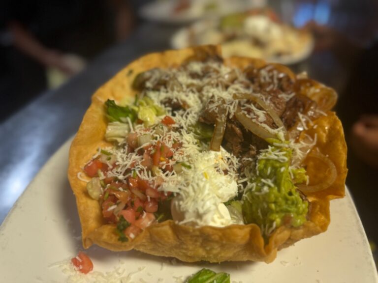 Steak fajitas taco salad with grilled peppers and onions at La Tapatia